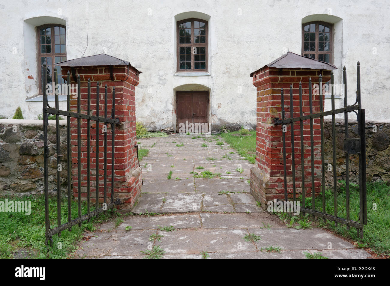 The gate. Rujiena St. Bartholomew`s Church was built approximately 1259-1263. Rujiena, Widzeme. Latvia Stock Photo